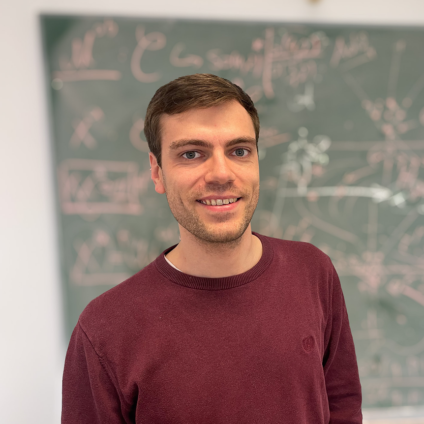 Christian Gaß in front of a blackboard